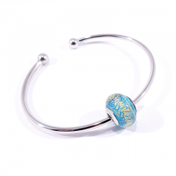 Bracelet jonc argent accompagné d'une perle en verre de murano bleu océan pailleté or.