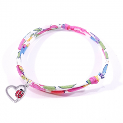 bracelet tissu liberty fleur de fuchsia avec coccinelle posée sur cœur en argent.