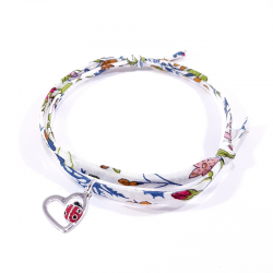 bracelet tissu liberty fleur de grenade avec coccinelle posée sur cœur en argent.